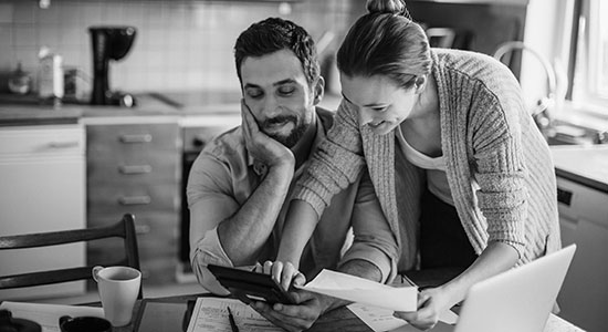 Young couple working on computer together