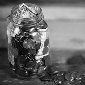 Jar full of change on a tabletop