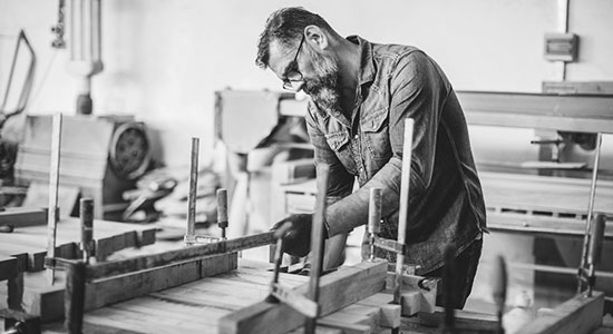 Older man working in a woodshop