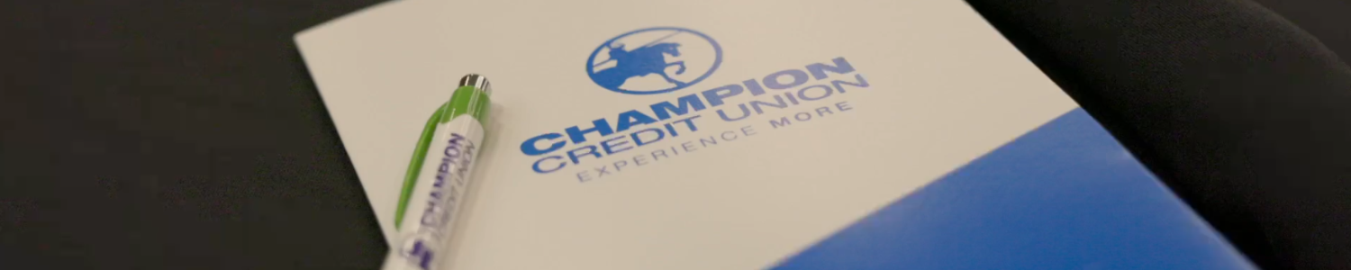 Champion CU folder and pen.