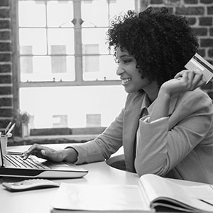 African American woman buying something online with credit card