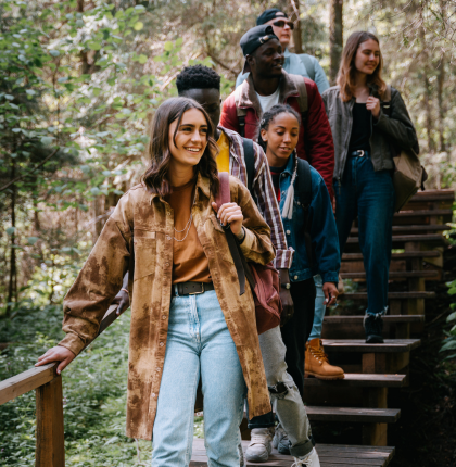 Teenagers hiking in the forest.
