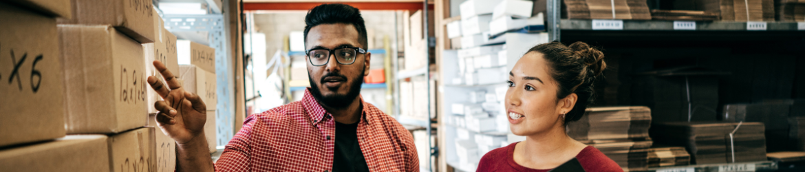 Employees looking at back office boxes.