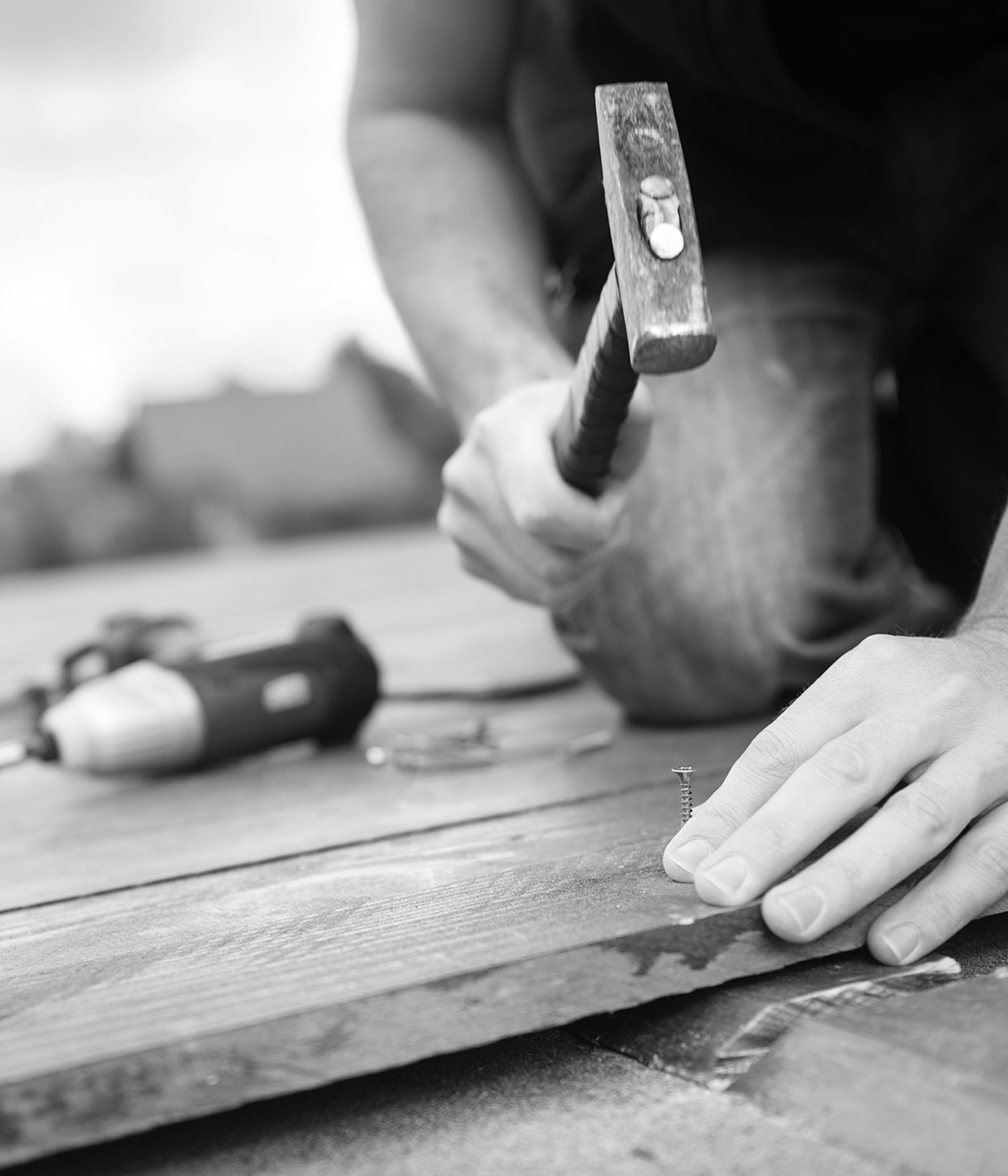 Man with tools works on home renovation project